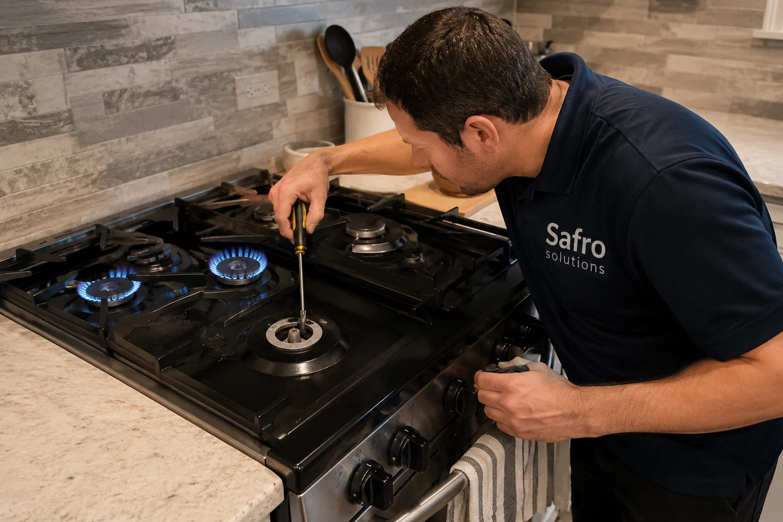 Safro Solutions technician inspecting a gas stove with some burners working and another burner not heating